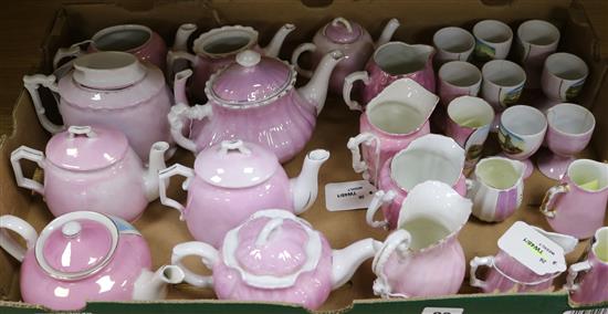 A collection of German pink lustre souvenir china, including teapots, cream jugs and eggcups (26, faults)